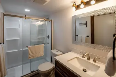 a bathroom with a shower and a sink and a toilet at Carnelian Woods #126 By Hauserman Rentals in Carnelian Bay