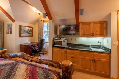 a room with a kitchen with a sink and a microwave at Poplar Place By Hauserman Rentals in Homewood
