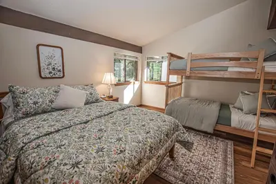 a bedroom with two bunk beds and a bed at Casa Pasquale By Hauserman Rentals in Carnelian Bay