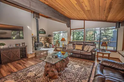 a living room with a couch and a table at Casa Pasquale By Hauserman Rentals in Carnelian Bay