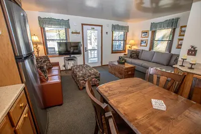 a living room with a couch and a table at Franciscan Lakeside # 29 By Hauserman Rentals in Tahoe Vista