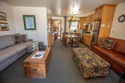 a living room with a couch and a table at Franciscan Lakeside # 29 By Hauserman Rentals in Tahoe Vista