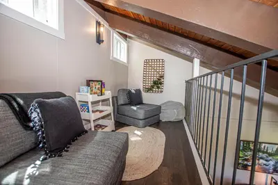 a living room with a couch and a chair at St Francis #53 By Hauserman Rentals in Tahoe City