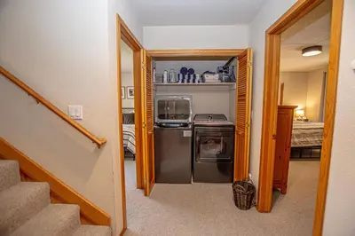 a small kitchen with a stove and a refrigerator at Eagle Pines By Hauserman Rentals in Tahoe City