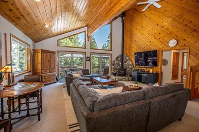 a large living room with couches and a tv at Eagle Pines By Hauserman Rentals in Tahoe City
