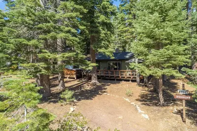 an aerial view of a cabin in the woods at Squirrels Nest By Hauserman Rentals in Carnelian Bay