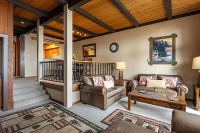 a living room with two couches and a table at Star Harbor # 4 By Hauserman Rentals in Tahoe City