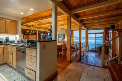 a kitchen with a view of the ocean in a house at Star Harbor # 15 By Hauserman Rentals in Tahoe City