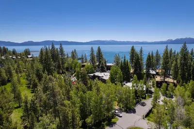 an aerial view of a resort with trees and a lake at Star Harbor # 15 By Hauserman Rentals in Tahoe City