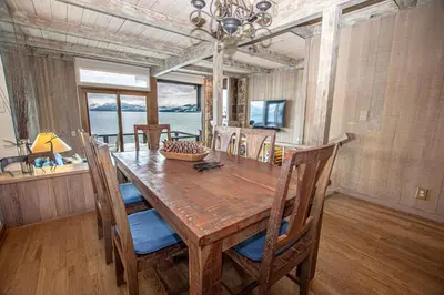 a dining room with a wooden table and chairs at Star Harbor # 8 By Hauserman Rentals in Tahoe City