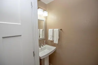 a bathroom with a sink and a mirror and towels at Stephens Retreat By Hauserman Rentals in Carnelian Bay