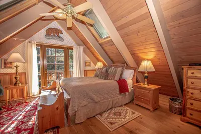 a bedroom with a bed and a ceiling fan at Willow By Hauserman Rentals in Tahoe City