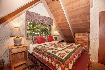 a bedroom with a large bed and a window at Willow By Hauserman Rentals in Tahoe City