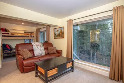 a living room with a couch and a table at Weathertop By Hauserman Rentals in Tahoe City