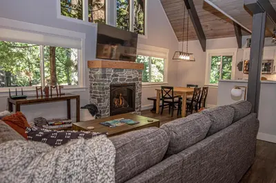 a living room with a couch and a fireplace at Price Haus By Hauserman Rentals in Tahoe City