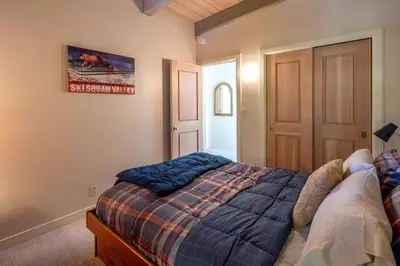 a bedroom with a bed and a painting on the wall at Star Harbor # 6 By Hauserman Rentals in Tahoe City