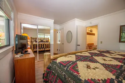 a bedroom with a bed and a tv in it at St Francis #18 By Hauserman Rentals in Tahoe City