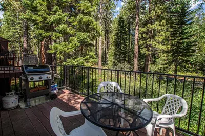 a patio with a table and chairs and a grill at St Francis #18 By Hauserman Rentals in Tahoe City