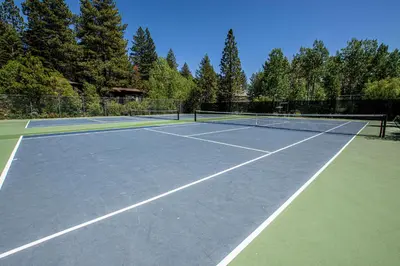 a tennis court with two tennis nets on it at St Francis #18 By Hauserman Rentals in Tahoe City