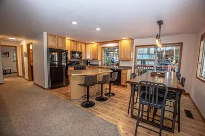 a kitchen with a island in the middle of it at Daly's Digs By Hauserman Rentals in Tahoe City