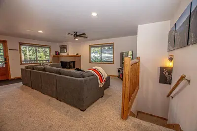 a living room with a couch and a fireplace at Daly's Digs By Hauserman Rentals in Tahoe City