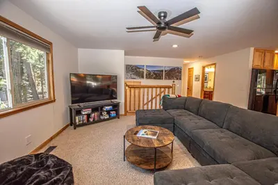 a living room with a couch and a ceiling fan at Daly's Digs By Hauserman Rentals in Tahoe City