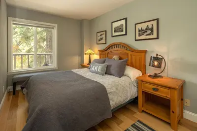 a bedroom with a large bed and a window at Dollar Hill II # 25 By Hauserman Rentals in Tahoe City