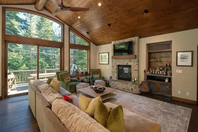 a living room with a couch and a fireplace at Aspen Grove By Hauserman Rentals in Tahoe City