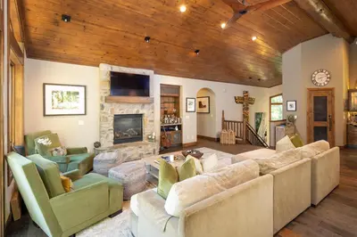a living room with a couch and a fireplace at Aspen Grove By Hauserman Rentals in Tahoe City