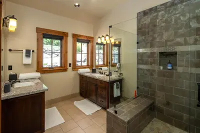 a large bathroom with a shower and a sink at Peaceful Waters By Hauserman Rentals in Tahoma