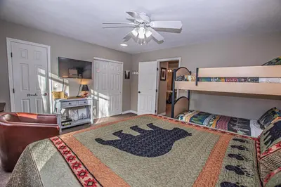 a bedroom with a bed and a bunk bed at Lake Forest Glen # 117 By Hauserman Rentals in Tahoe City