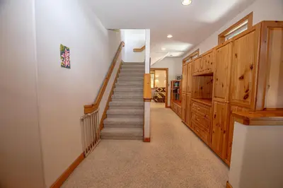 a staircase in a house with wooden walls and a stair case at KT22 View By Hauserman Rentals in Olympic Valley