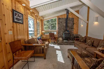 a living room with a couch and a fireplace at KT22 View By Hauserman Rentals in Olympic Valley