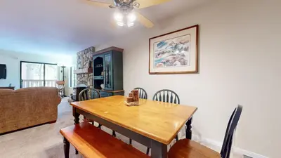 a dining room with a wooden table and chairs at Summit #243 condo in Mammoth Lakes