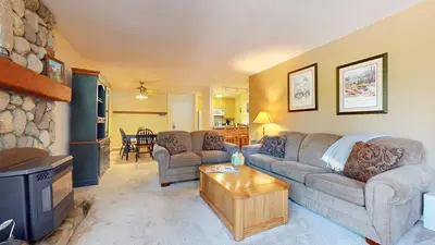 a living room with a couch and a tv at Summit #243 condo in Mammoth Lakes