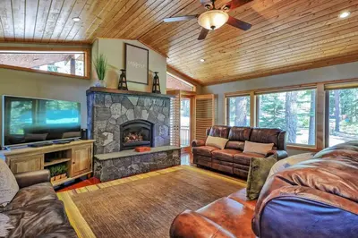 a living room with a couch and a fireplace at Tahoma Family Home in Tahoma