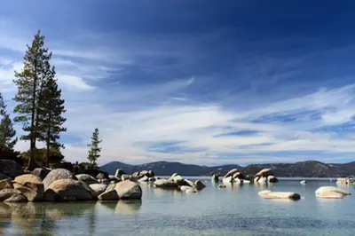 a group of rocks in a body of water at Tahoma Family Home in Tahoma
