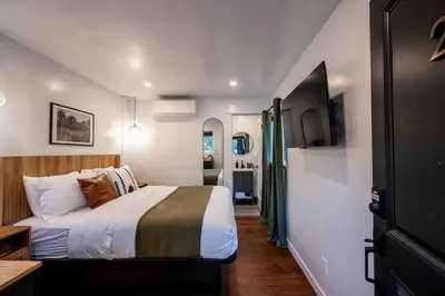 a bedroom with a bed in a small room at Columbia Cabins Cabin 2 in Sonora