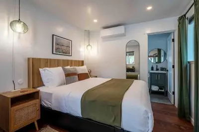 a bedroom with a large bed in a room at Columbia Cabins Cabin 3 in Sonora