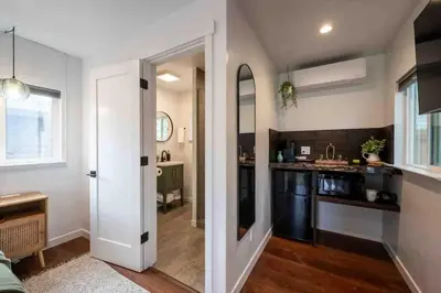 a kitchen with a door leading into a kitchen with a sink at Columbia Cabins Cabin 4 in Sonora