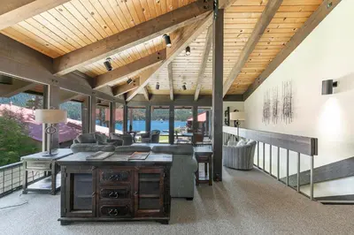 an open living room with a wooden ceiling at Spacious 1BR Condo #218 at Donner Lake Village in Truckee