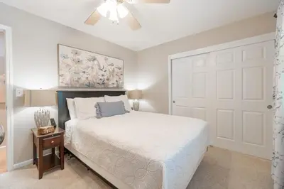 a bedroom with a white bed and a white door at Truckee Mountain Retreat Family Friendly 3BR 2BA in Truckee