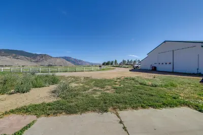 a dirt road next to a building with mountains in the background at 11 Mi to Heavenly Resort Pet-Friendly Tiny Home in Gardnerville