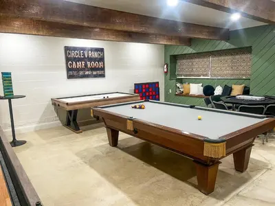 a billiard room with two pool tables in it at Yosemite Family Lodge I Sleeps 11 I Game Room in Oakhurst