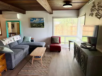 a living room with a couch and a table at Sam's Place Mariposa - In Town! in Mariposa