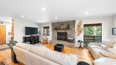 a living room with white furniture and a fireplace at Secluded Incline Village Stay w Deck Near Diamond Peak Lake Cloud 9 and 12 by AvantStay in Incline Village