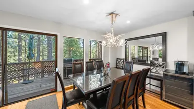 a dining room with a glass table and chairs at Secluded Incline Village Stay w Deck Near Diamond Peak Lake Cloud 9 and 12 by AvantStay in Incline Village