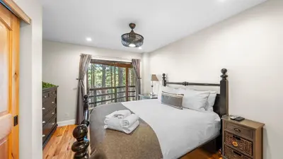 a bedroom with a bed and a window at Secluded Incline Village Stay w Deck Near Diamond Peak Lake Cloud 9 and 12 by AvantStay in Incline Village