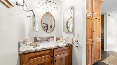 a bathroom with a sink and two mirrors at Secluded Incline Village Stay w Deck Near Diamond Peak Lake Cloud 9 and 12 by AvantStay in Incline Village