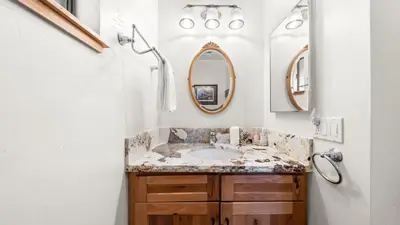 a bathroom with a sink and two mirrors at Secluded Incline Village Stay w Deck Near Diamond Peak Lake Cloud 9 and 12 by AvantStay in Incline Village